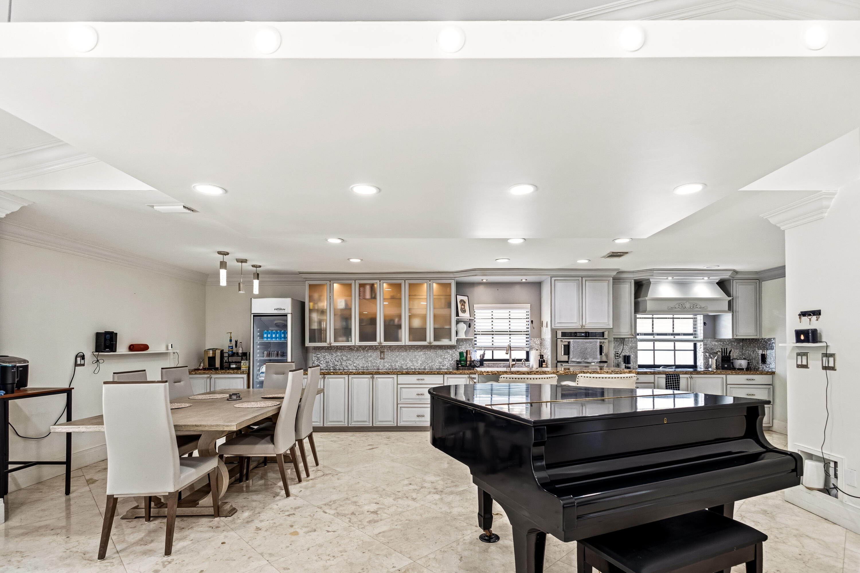 5223 Deerhurst Crescent Circle Boca Raton, FL 33486 - Photo 20 of 51 a kitchen with a table and chairs