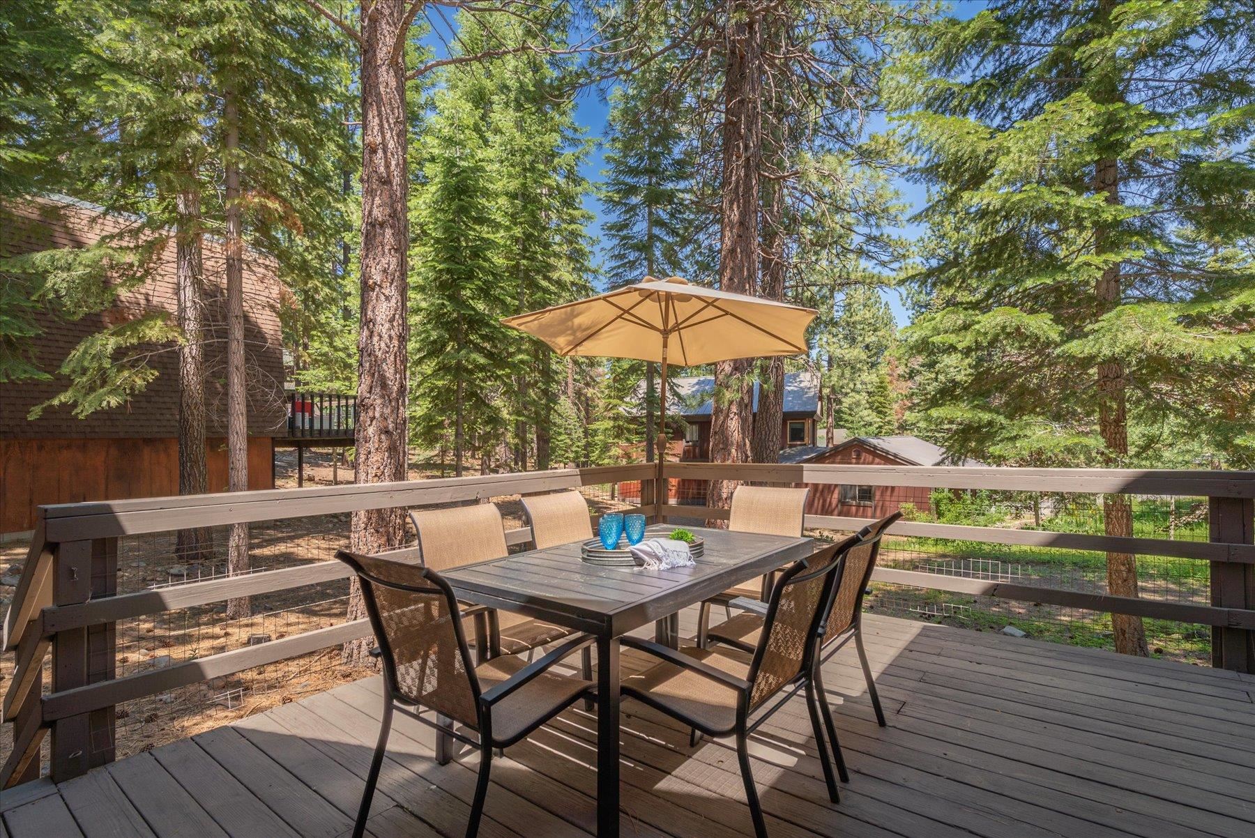1502 Logging Trail Truckee, CA 96161 - Photo 15 of 21 an outdoor space with furniture and umbrella