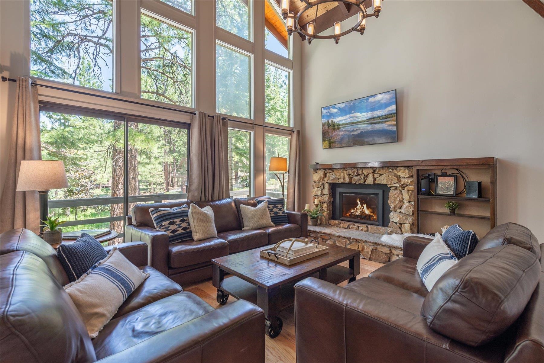 1502 Logging Trail Truckee, CA 96161 - Photo 2 of 21 a living room with furniture a large window and a fireplace