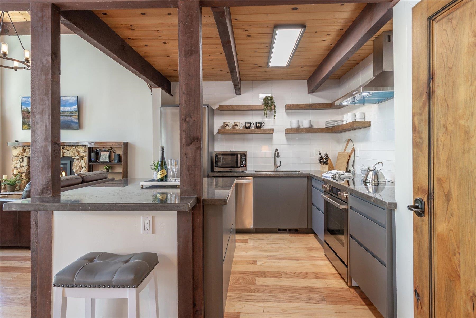 1502 Logging Trail Truckee, CA 96161 - Photo 4 of 21 a kitchen with stainless steel appliances granite countertop a sink and cabinets