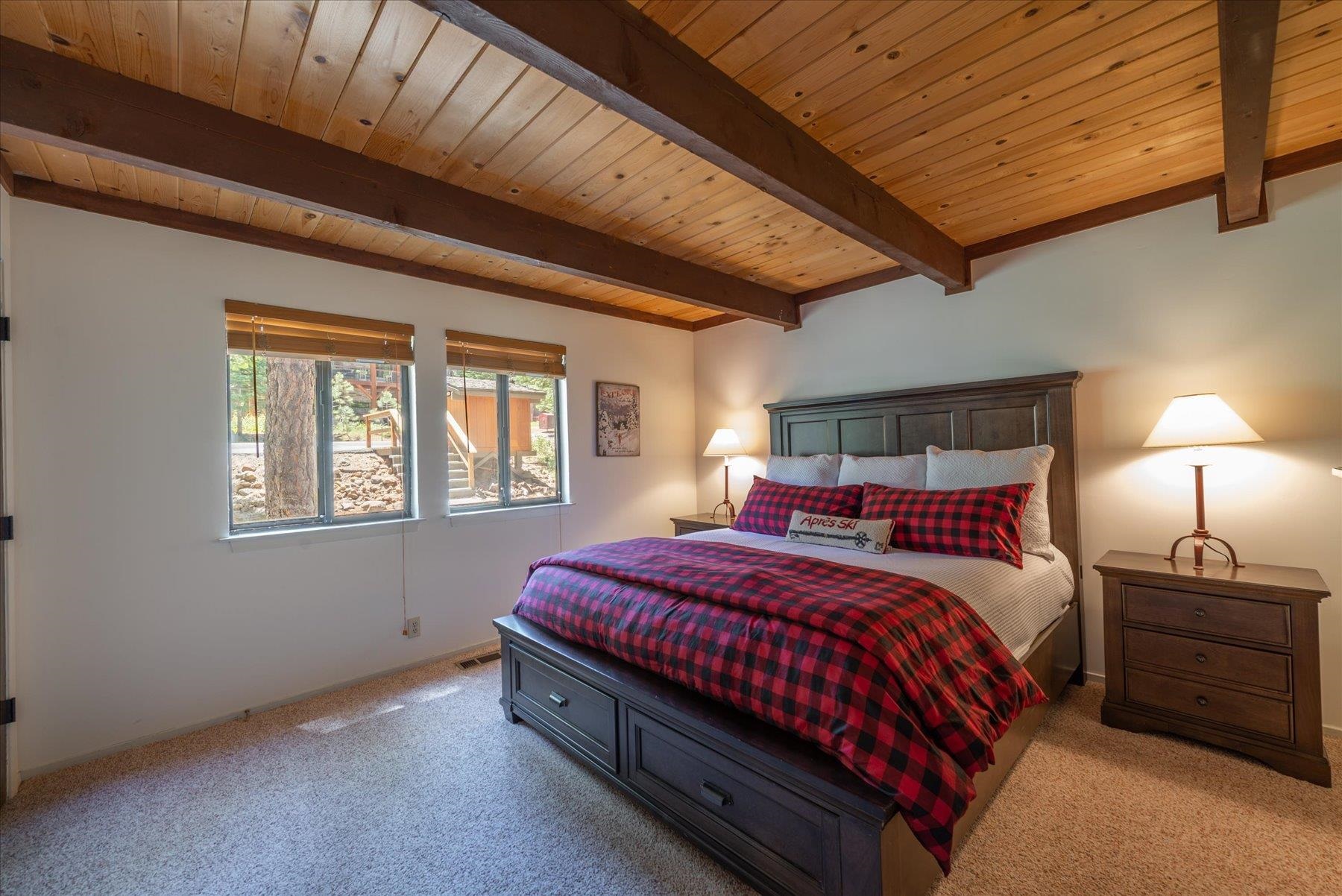 1502 Logging Trail Truckee, CA 96161 - Photo 8 of 21 a bedroom with a bed lamp and window