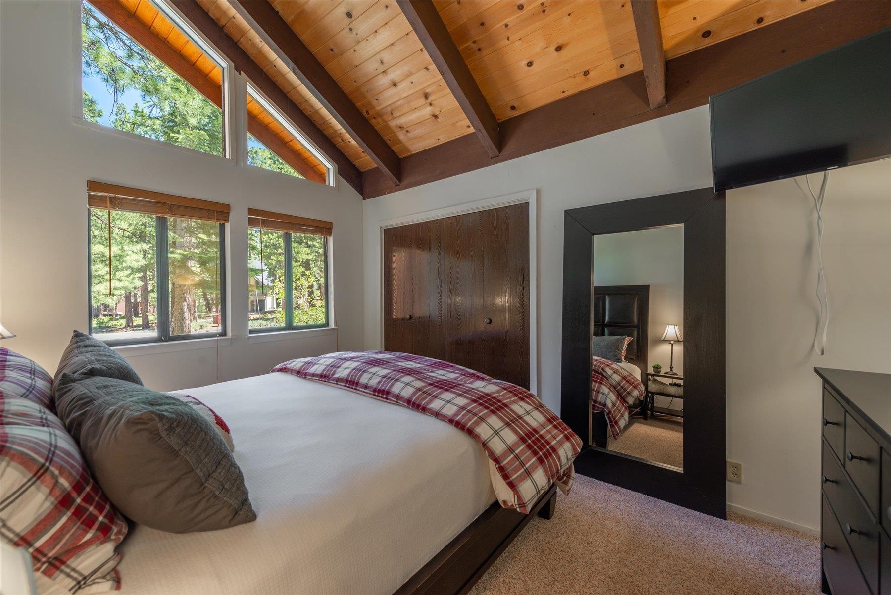 1502 Logging Trail Truckee, CA 96161 - Photo 10 of 21 a spacious bedroom with a bed and a large window