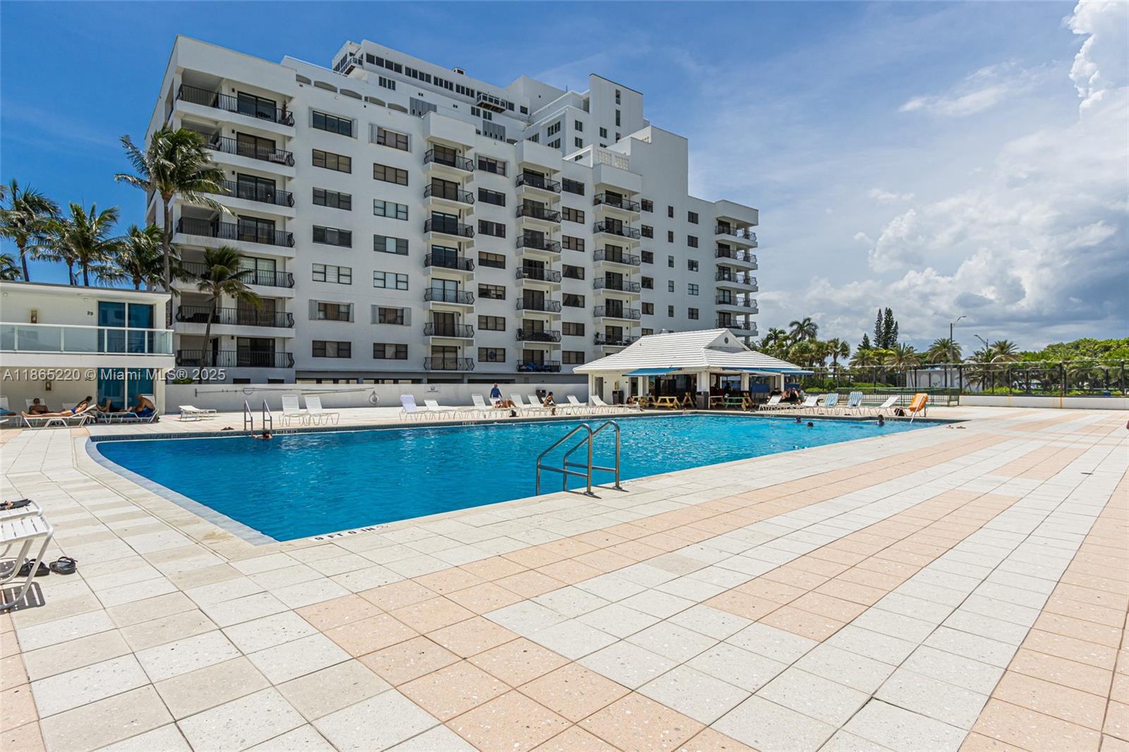 a view of pool with outdoor space and seating area
