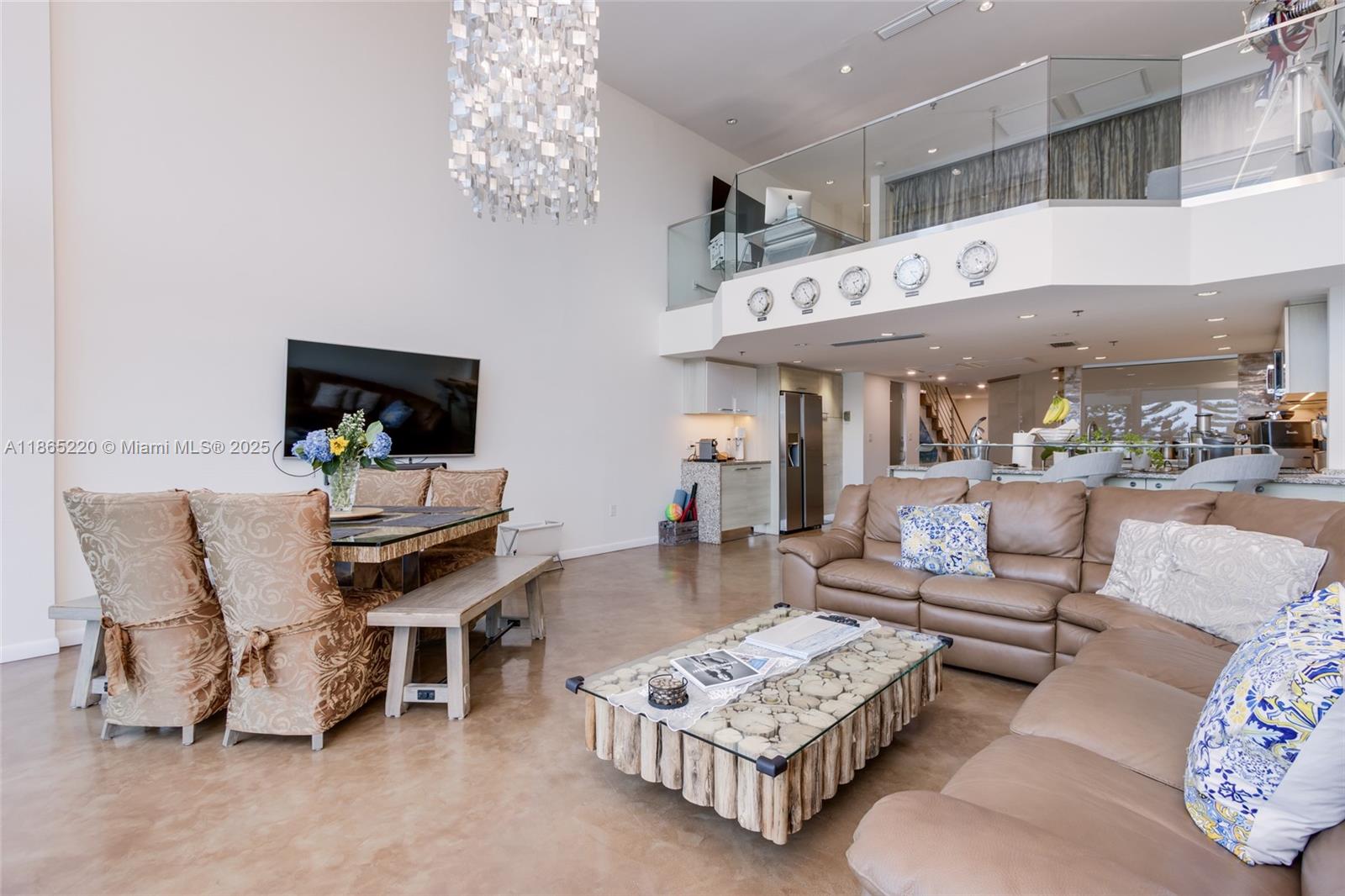 5445 Collins Avenue, Unit P2 Miami Beach, FL 33140 - Photo 15 of 62 a living room with furniture and a flat screen tv