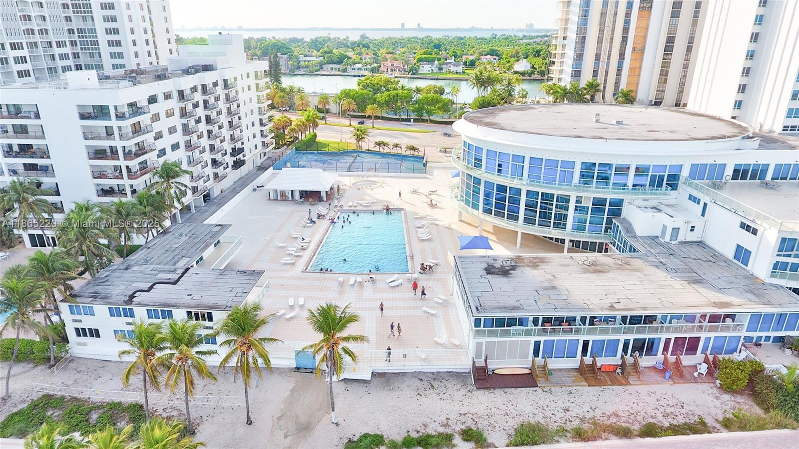 5445 Collins Avenue, Unit P2 Miami Beach, FL 33140 - Photo 2 of 62 an aerial view of a house with a swimming pool and outdoor seating