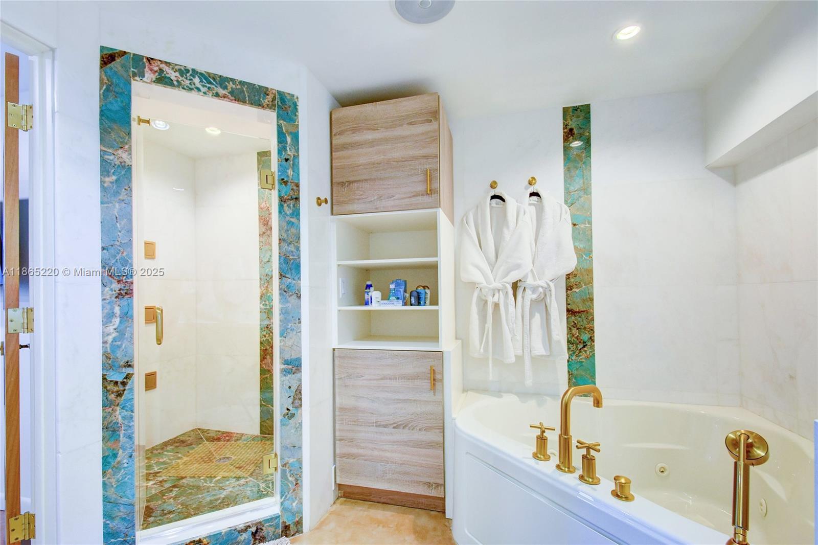 5445 Collins Avenue, Unit P2 Miami Beach, FL 33140 - Photo 30 of 62 a bathroom with a tub and shower