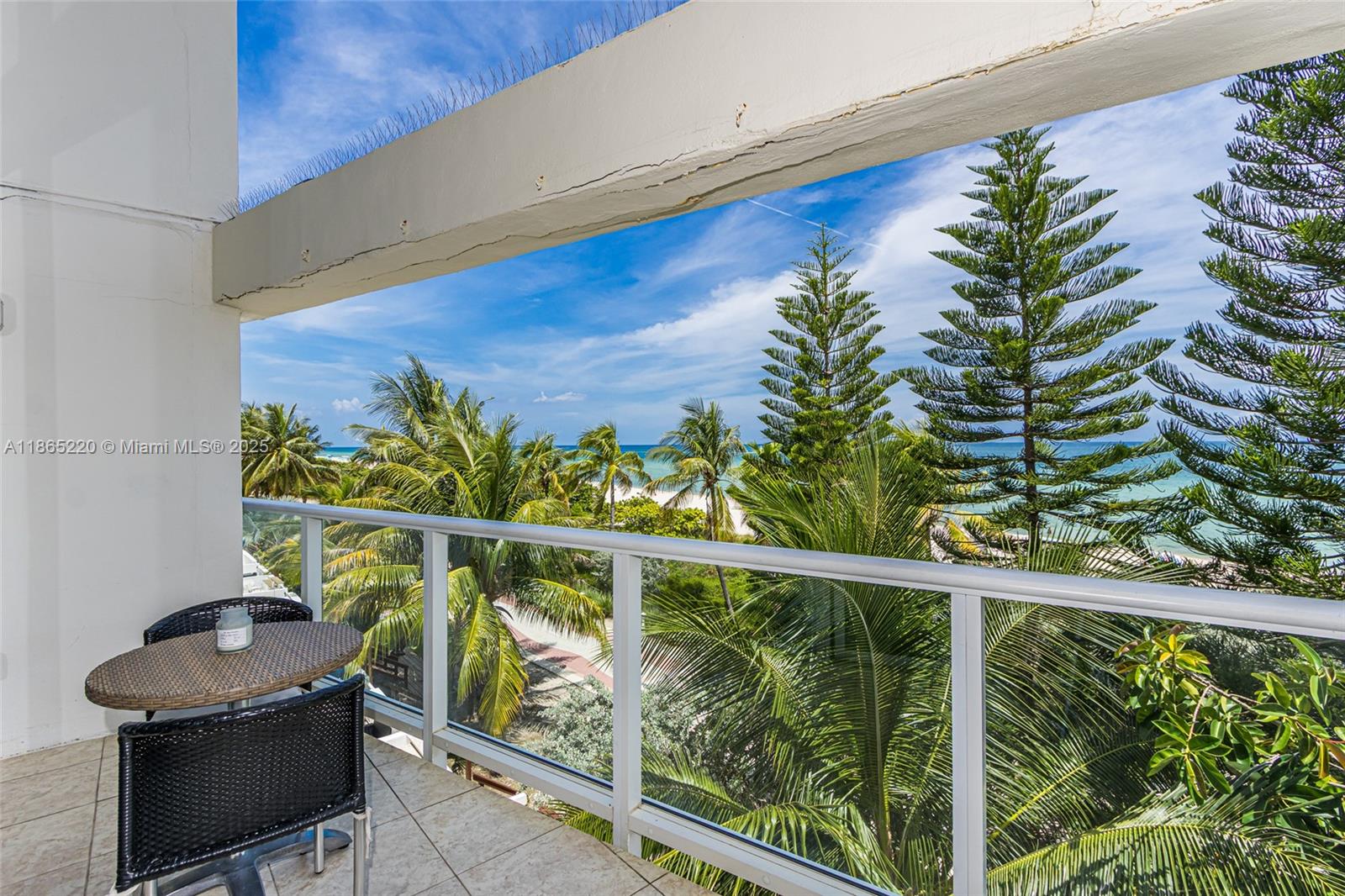 5445 Collins Avenue, Unit P2 Miami Beach, FL 33140 - Photo 36 of 62 a view of a balcony with chairs