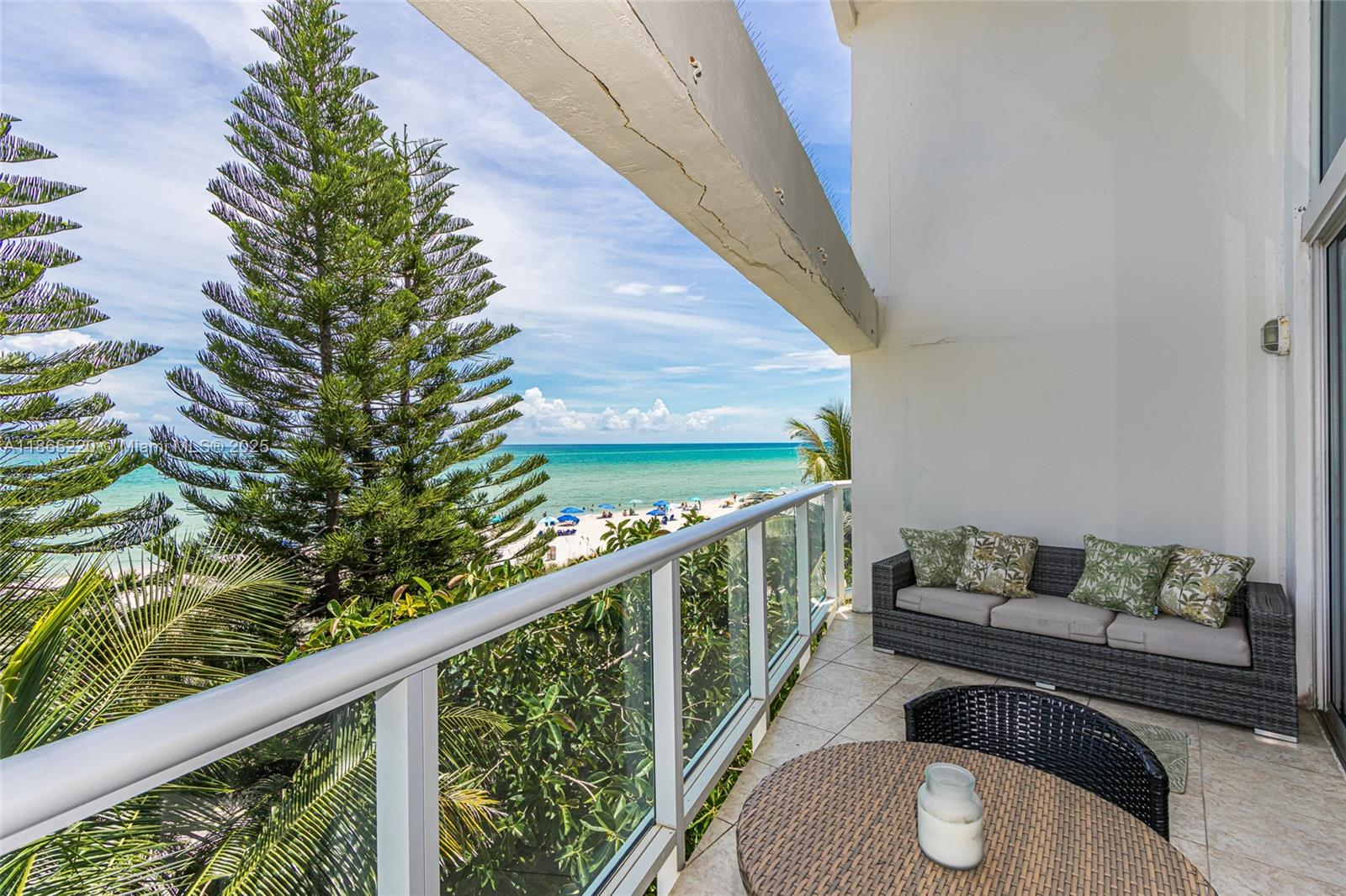 5445 Collins Avenue, Unit P2 Miami Beach, FL 33140 - Photo 37 of 62 a balcony view with a potted plant