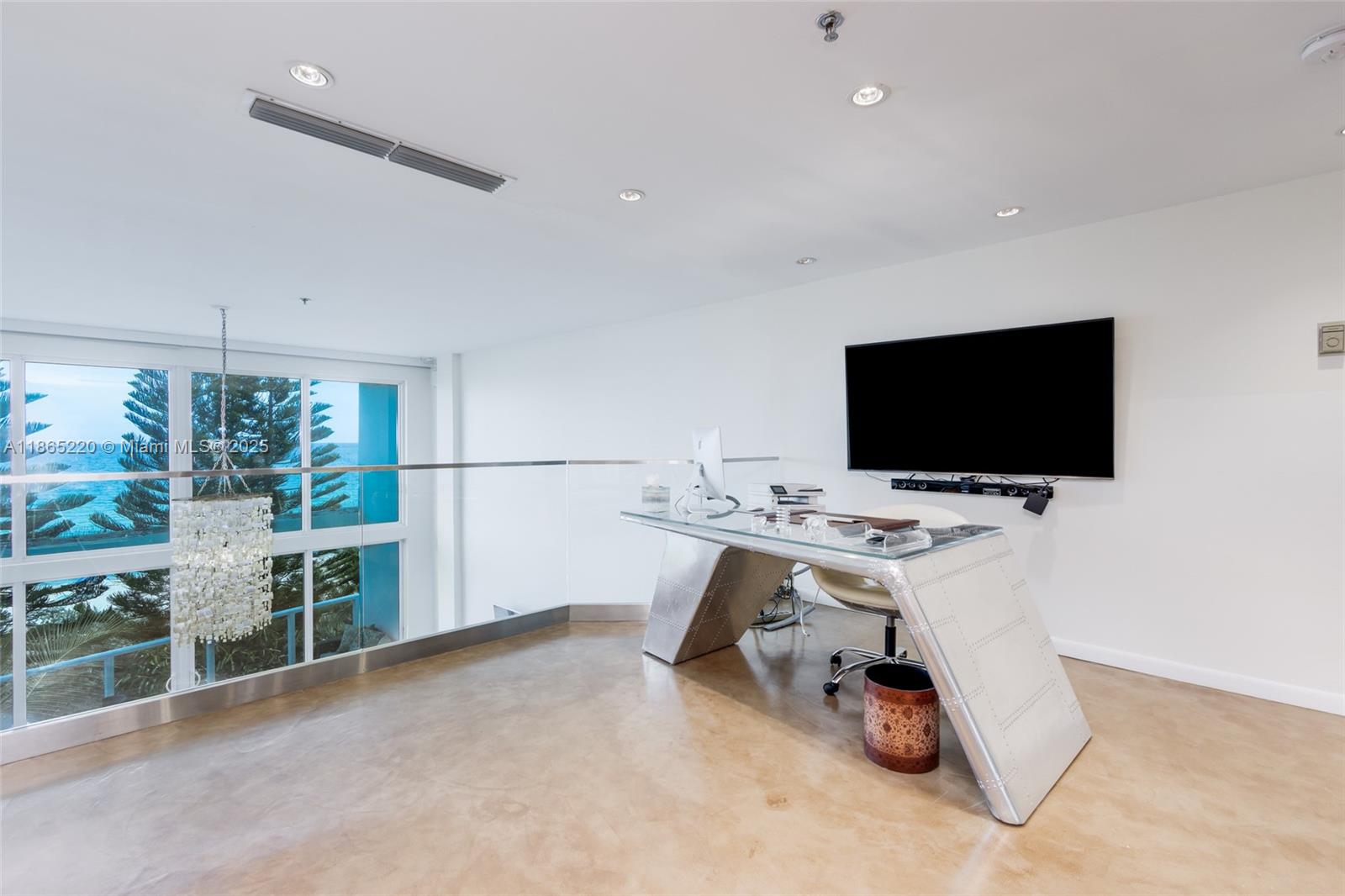 5445 Collins Avenue, Unit P2 Miami Beach, FL 33140 - Photo 54 of 62 a view of a livingroom with furniture and a flat screen tv