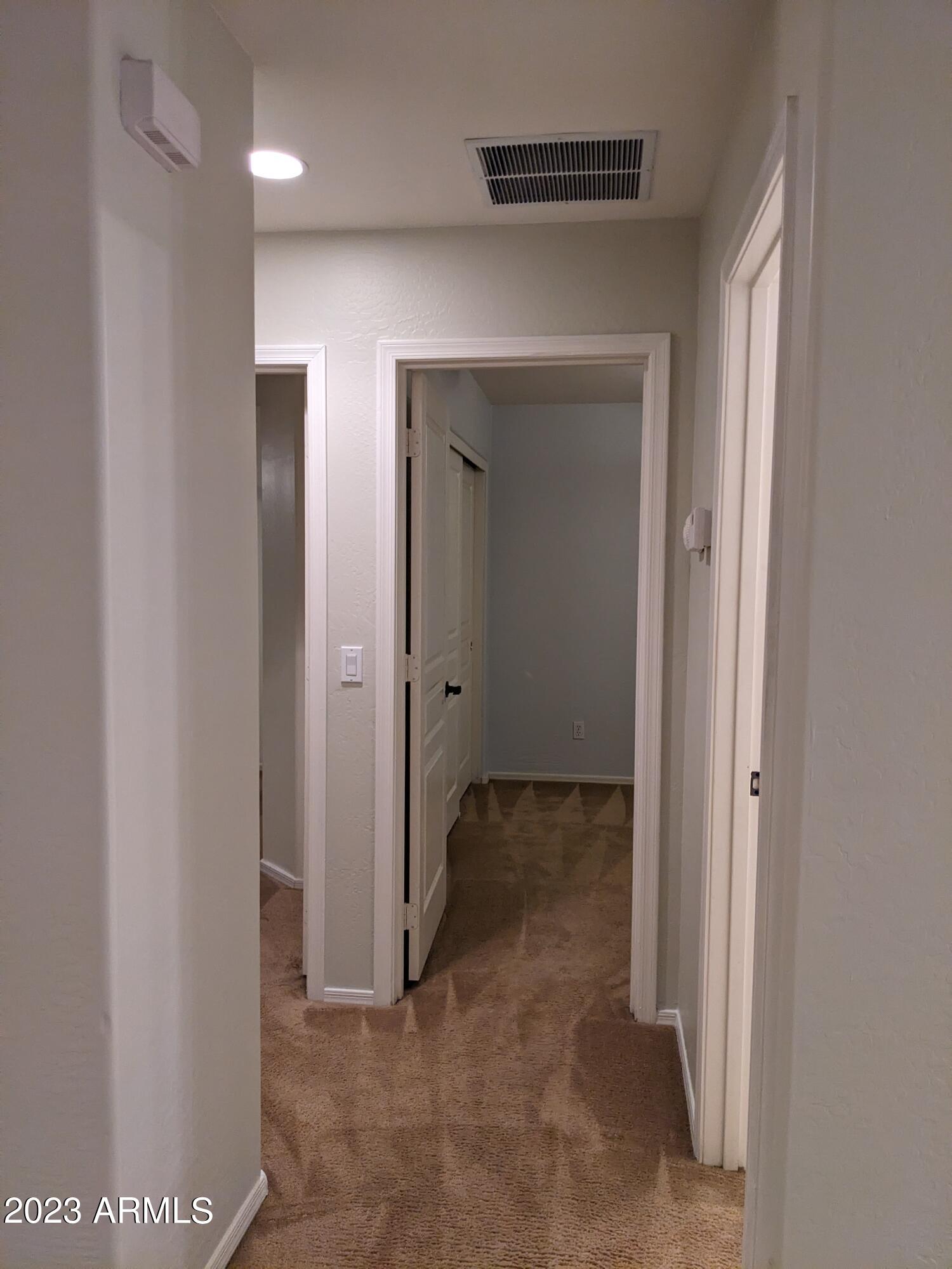 14099 West Riviera Drive Surprise, AZ 85379 - Photo 22 of 27 a view of a hallway with closet