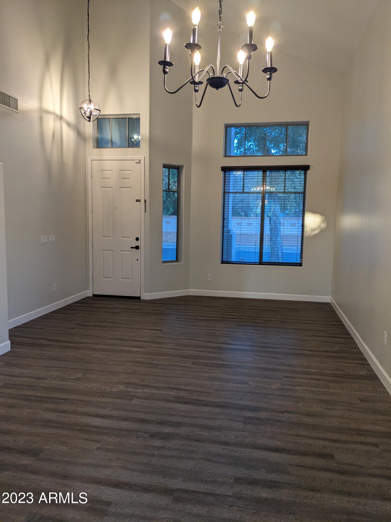 14099 West Riviera Drive Surprise, AZ 85379 - Photo 9 of 27 a view of a room with wooden floor