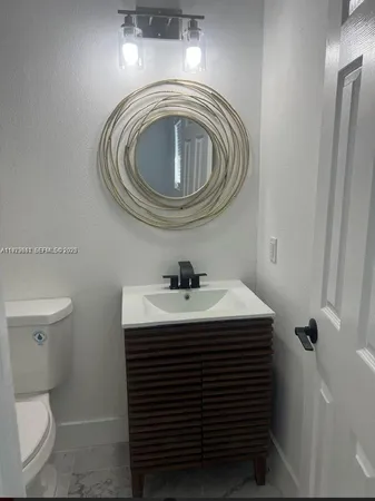 a bedroom with a bed and chair