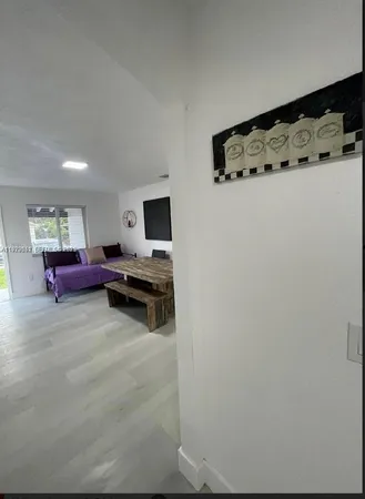 a bedroom with bed and dresser