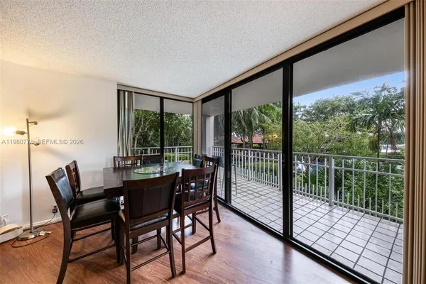 a view of a dining room with furniture window and outside view