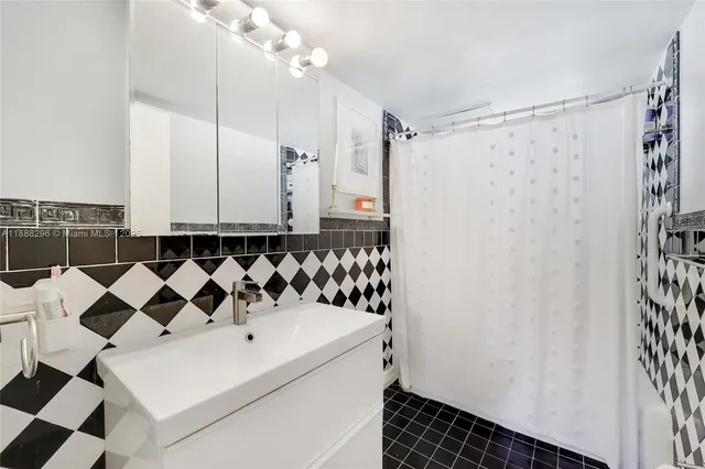 a bathroom with a bathtub and shower