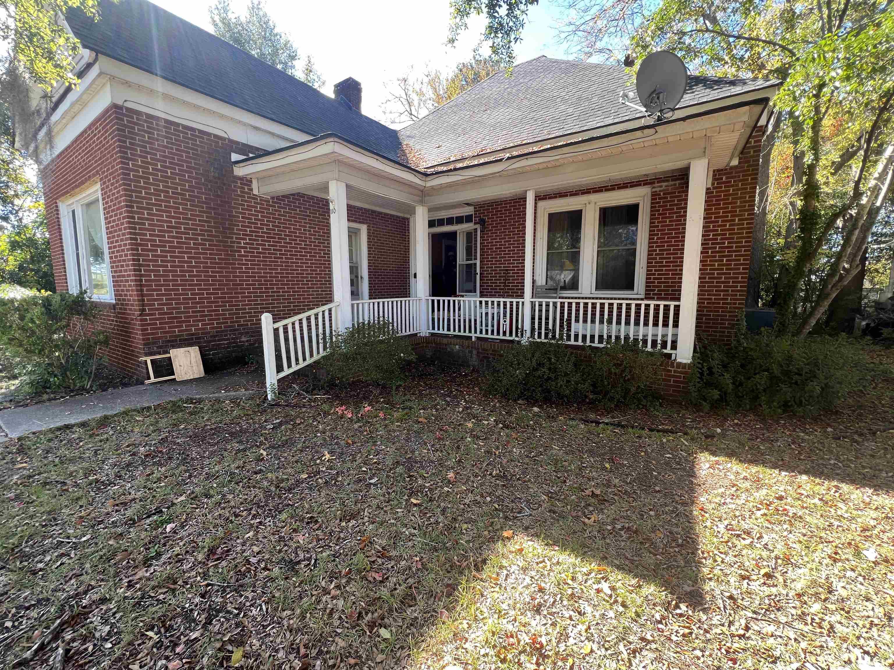 110 Gordon Street Kingstree, SC 29556 - Photo 2 of 8 View of front of house with brick siding and a chimney
