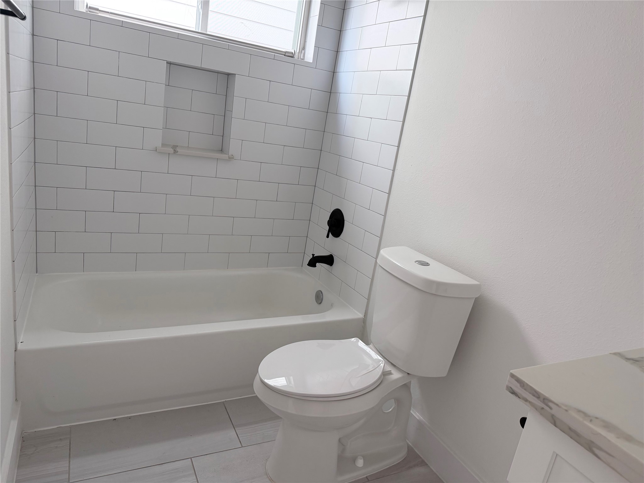 5928 Conley Street Houston, TX 77021 - Photo 12 of 12 a bathroom with a toilet and a shower