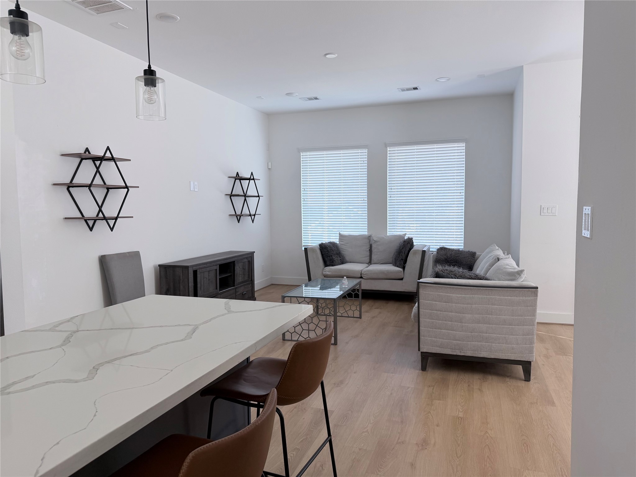 5928 Conley Street Houston, TX 77021 - Photo 5 of 12 a living room with furniture and wooden floor