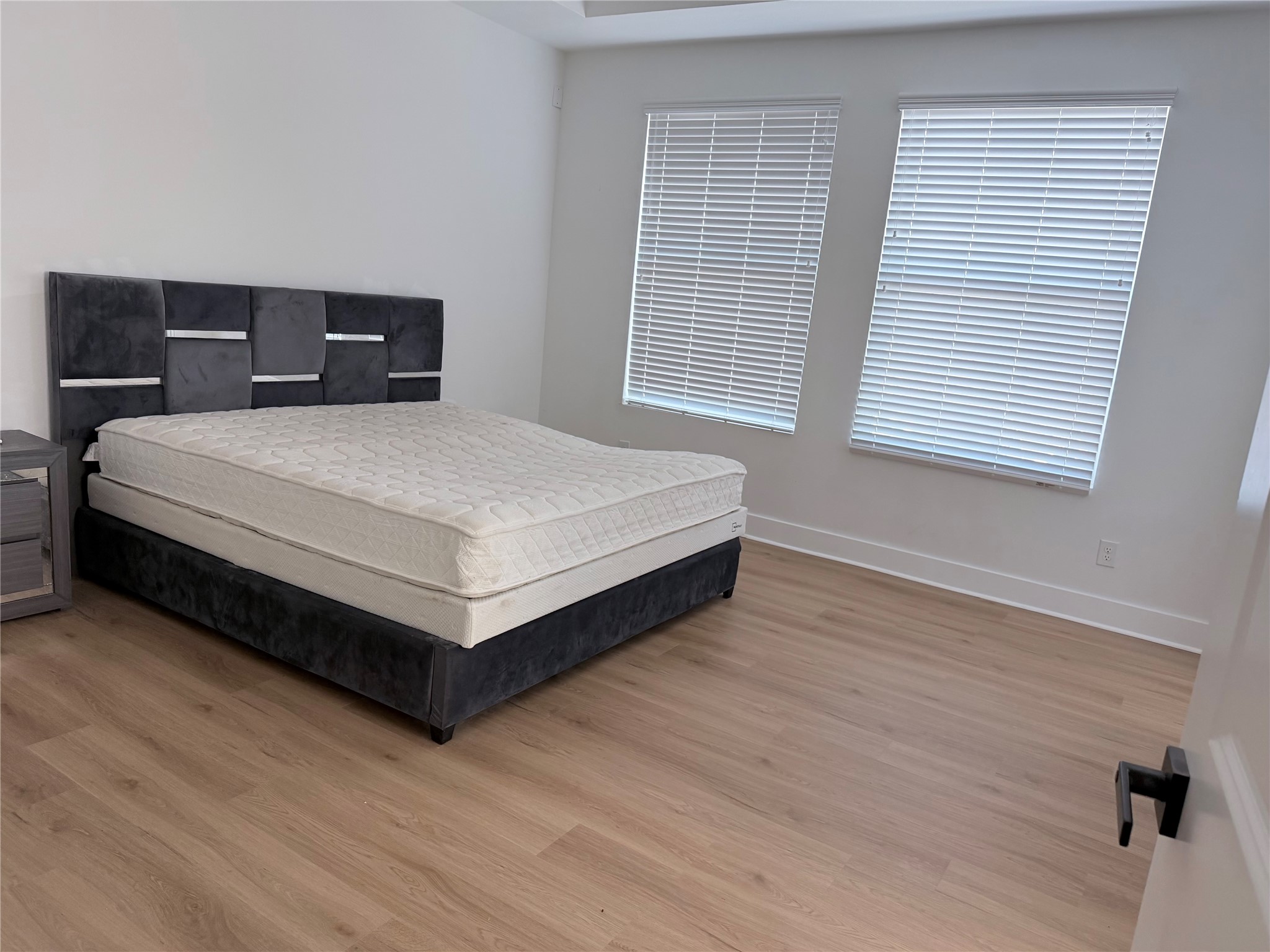 5928 Conley Street Houston, TX 77021 - Photo 8 of 12 a bedroom with a bed and window