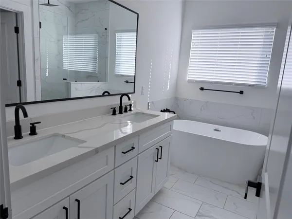 a bathroom with a sink and a bathtub