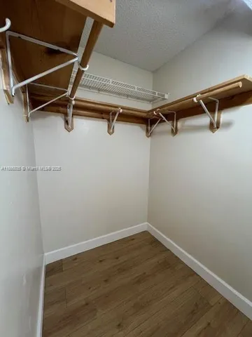 a view of a room with racks on the wall