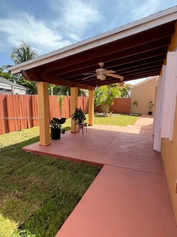 a view of a backyard of the house