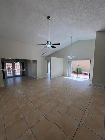 a room with lots of furniture and a chandelier