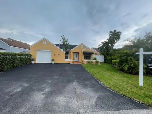 a front view of a house with yard