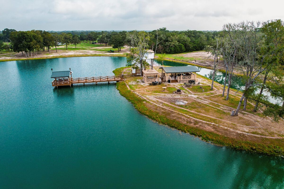 1331 East Parker Road Muldoon, TX 78949 - Photo 12 of 12 an aerial view of a house with a lake view