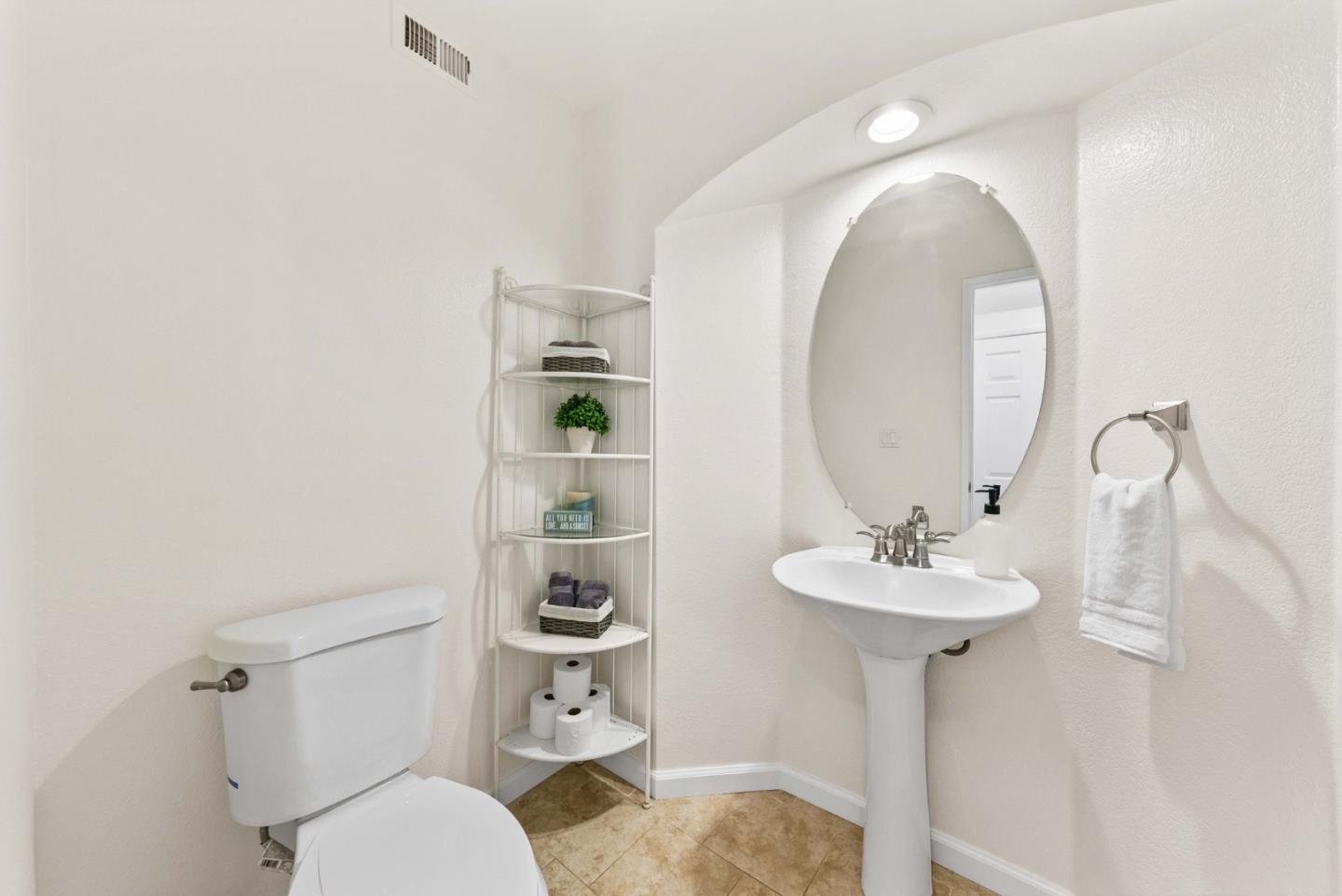 7385 Forsum Road San Jose, CA 95138 - Photo 14 of 40 a bathroom with a sink a toilet and a mirror