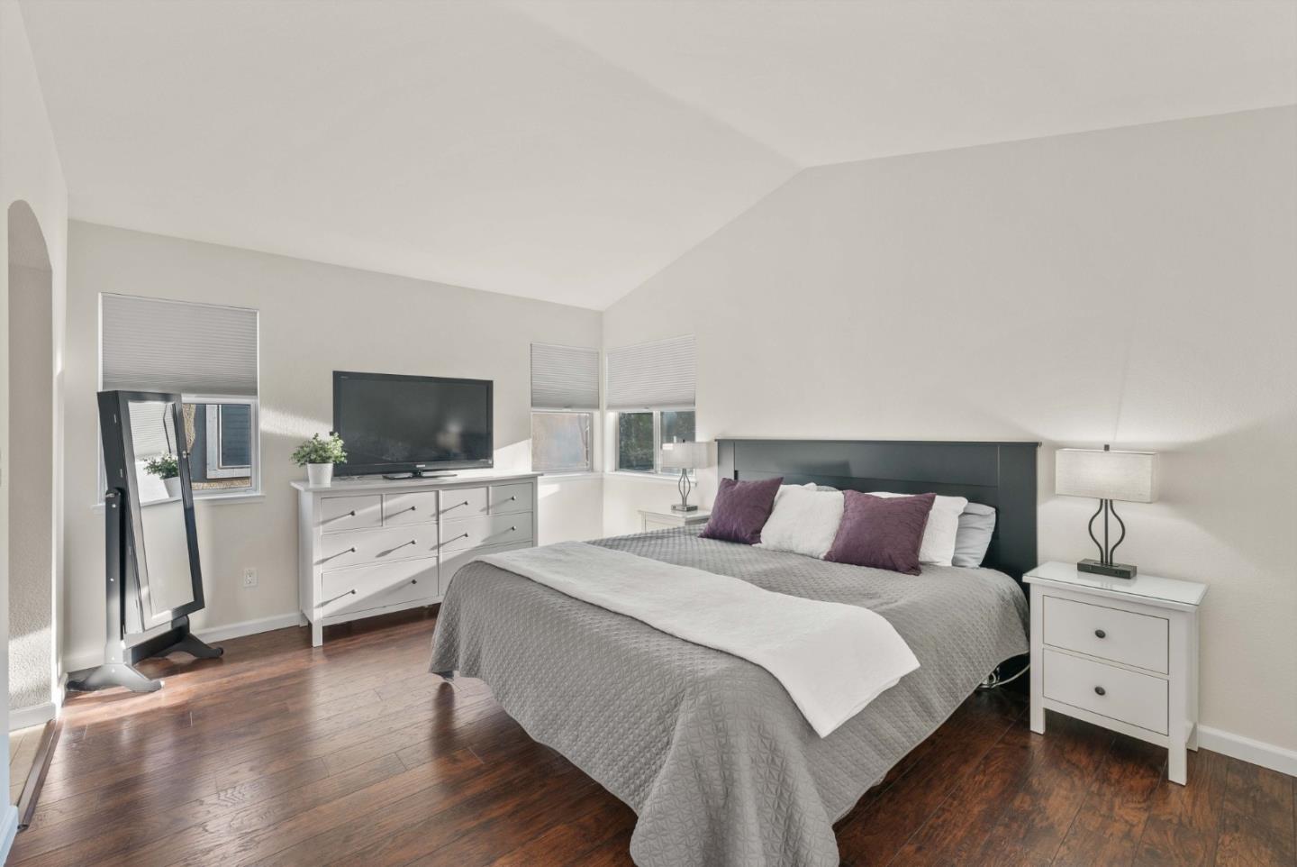 7385 Forsum Road San Jose, CA 95138 - Photo 16 of 40 a bedroom with a bed and a flat screen tv