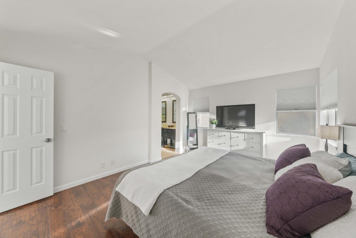 7385 Forsum Road San Jose, CA 95138 - Photo 17 of 40 a bedroom with a bed and a television