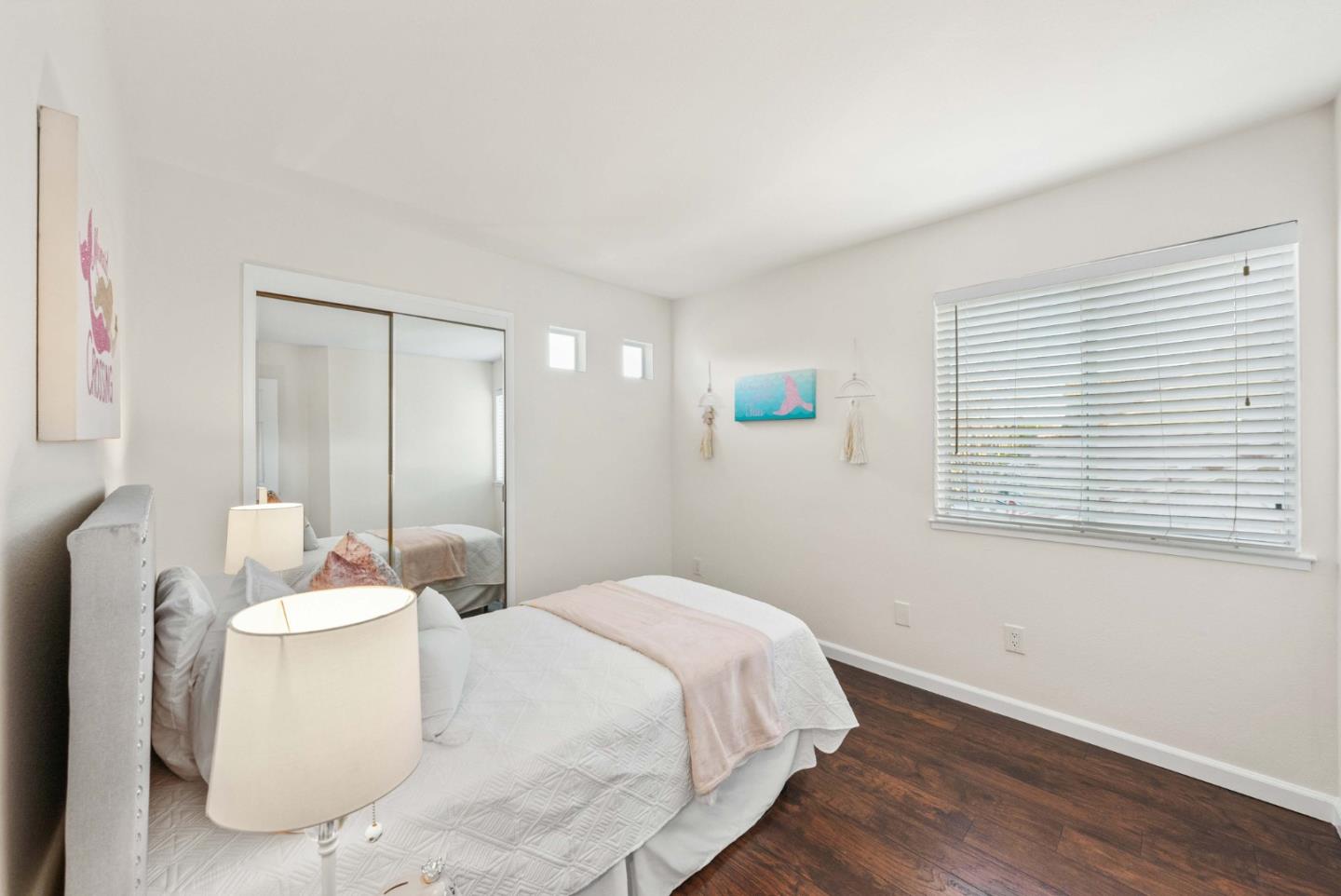 7385 Forsum Road San Jose, CA 95138 - Photo 23 of 40 a bedroom with a bed and a potted plant