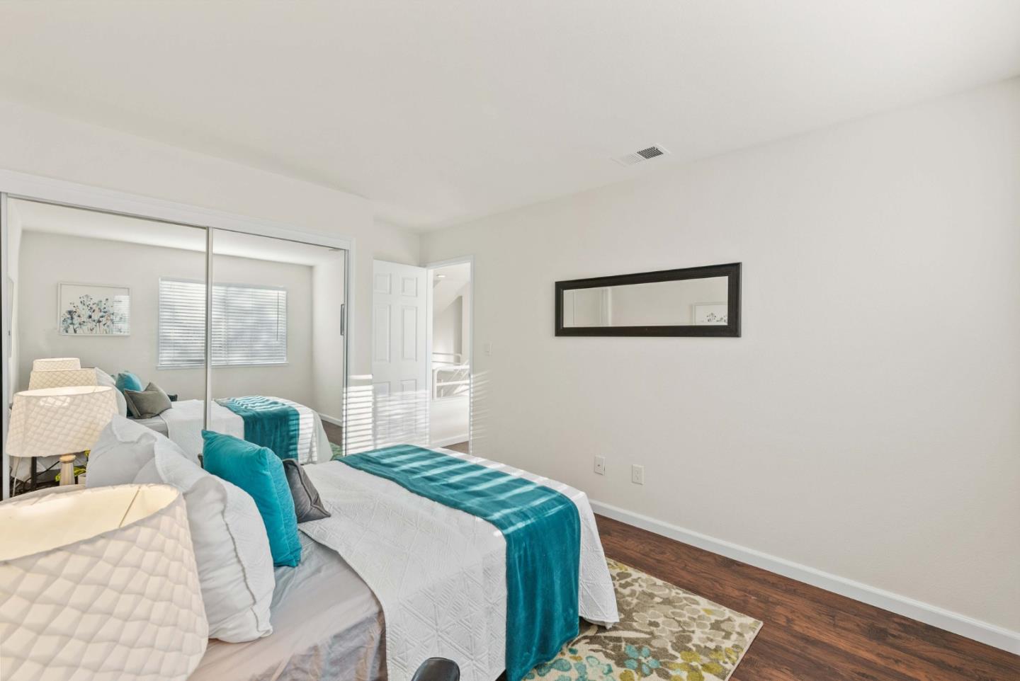 7385 Forsum Road San Jose, CA 95138 - Photo 28 of 40 a bedroom with a bed and a large window