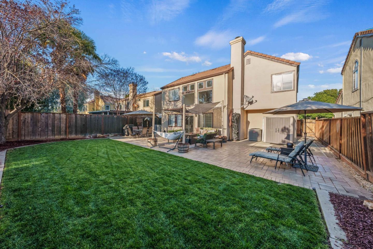 7385 Forsum Road San Jose, CA 95138 - Photo 29 of 40 a view of a patio with table and chairs a barbeque with wooden fence
