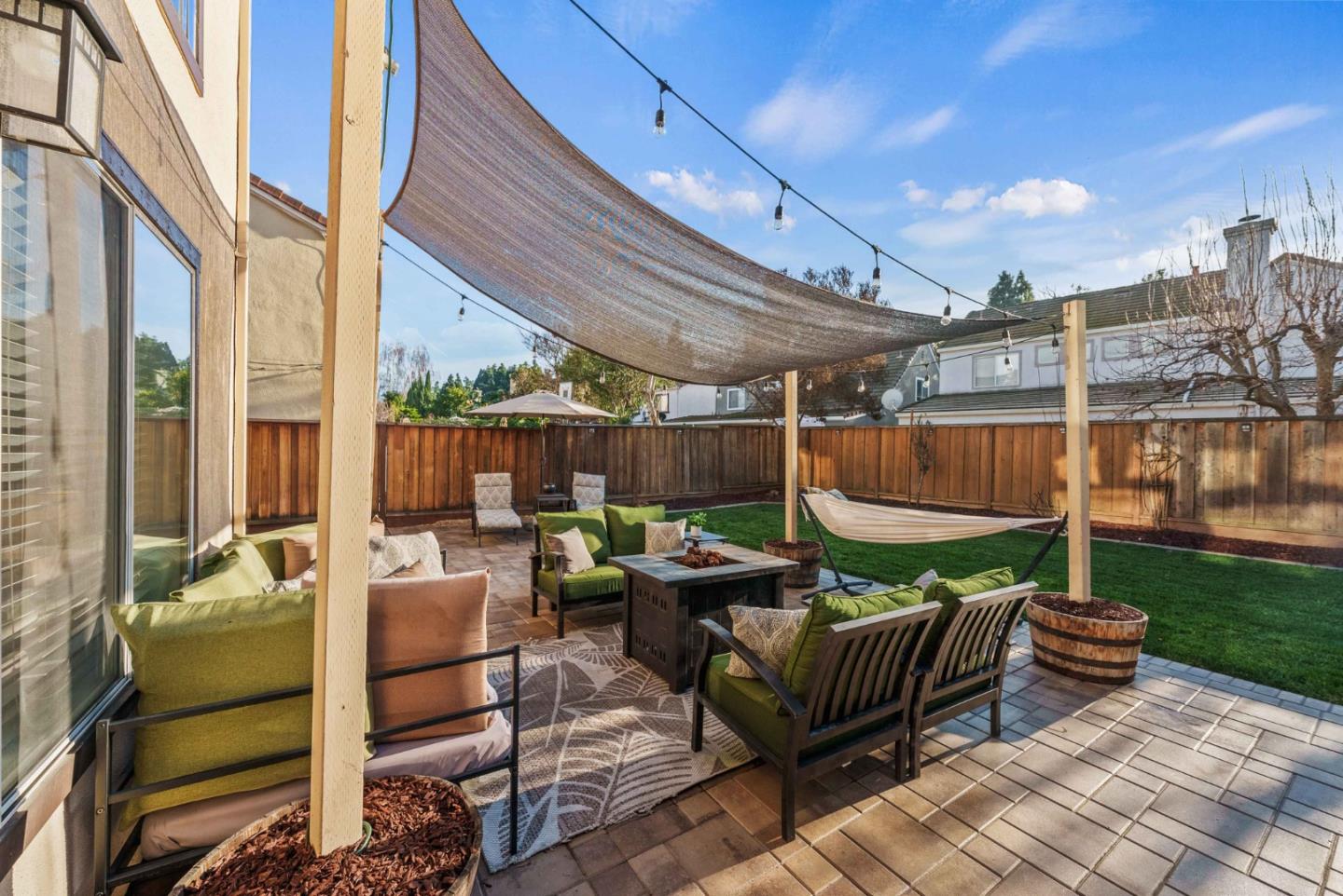 7385 Forsum Road San Jose, CA 95138 - Photo 30 of 40 a view of a patio with couches and a table and chairs with wooden floor