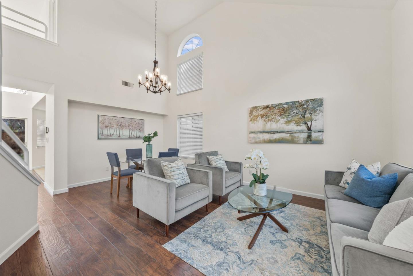 7385 Forsum Road San Jose, CA 95138 - Photo 3 of 40 a living room with furniture a dining table and a chandelier