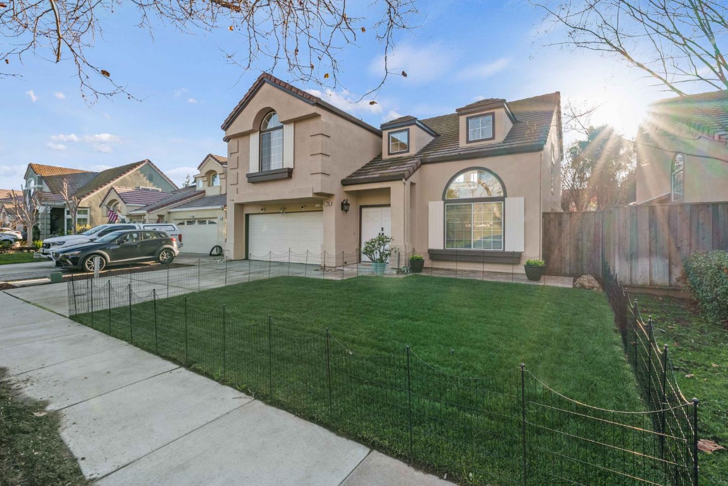 7385 Forsum Road San Jose, CA 95138 - Photo 34 of 40 a front view of a house with a big yard and large tree