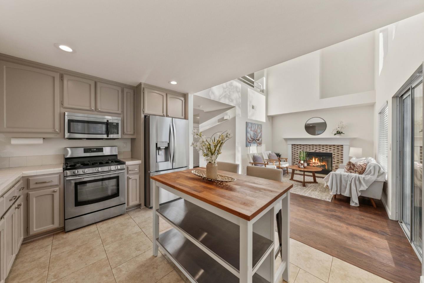 7385 Forsum Road San Jose, CA 95138 - Photo 5 of 40 a kitchen with kitchen island granite countertop a stove and a sink