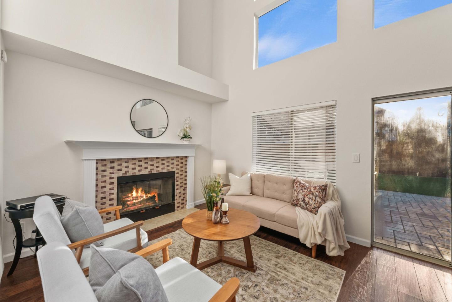 7385 Forsum Road San Jose, CA 95138 - Photo 10 of 40 a living room with furniture a fireplace and window
