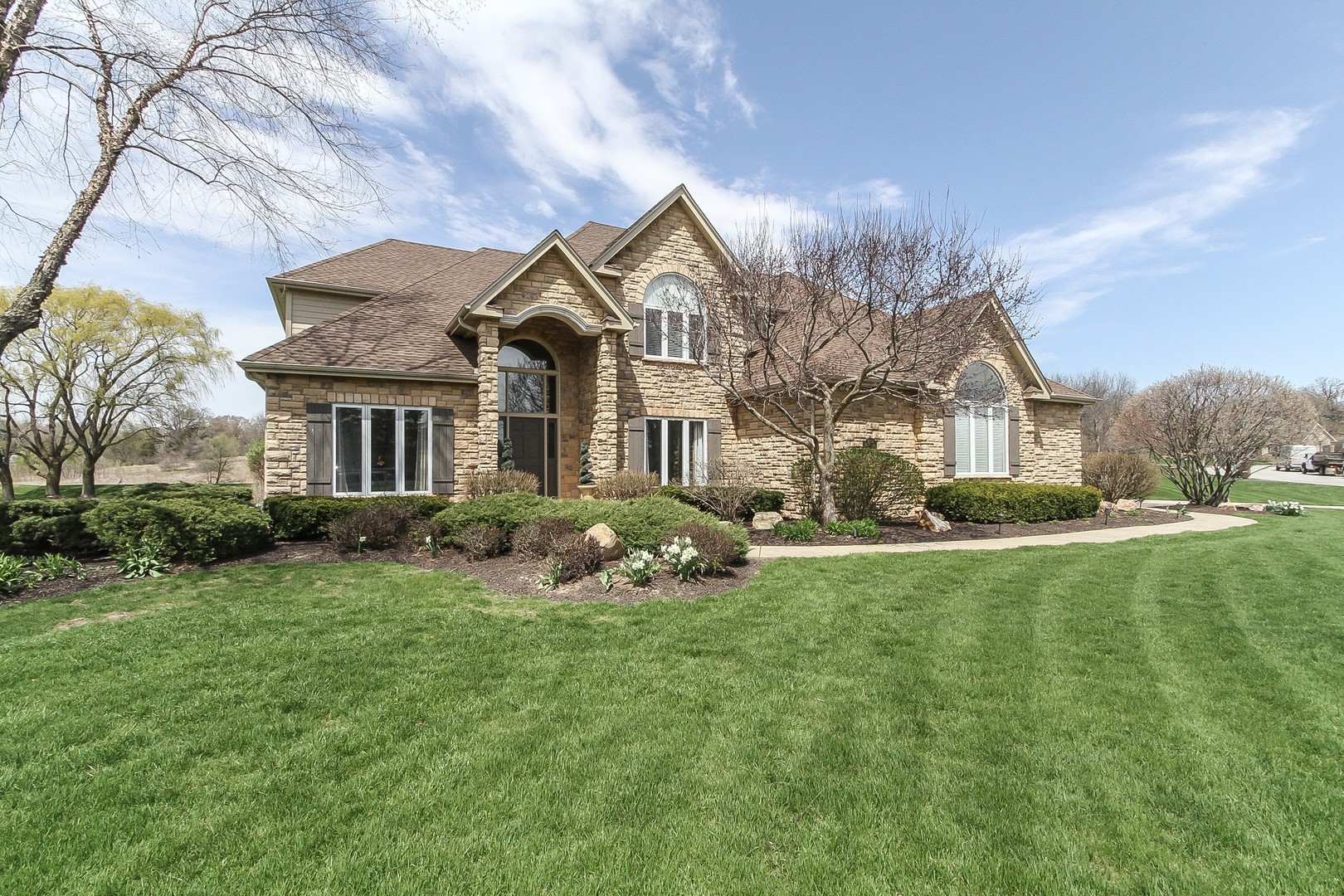 6N734 Henricksen Road St. Charles, IL 60175 - Photo 1 of 40 a front view of a house with garden