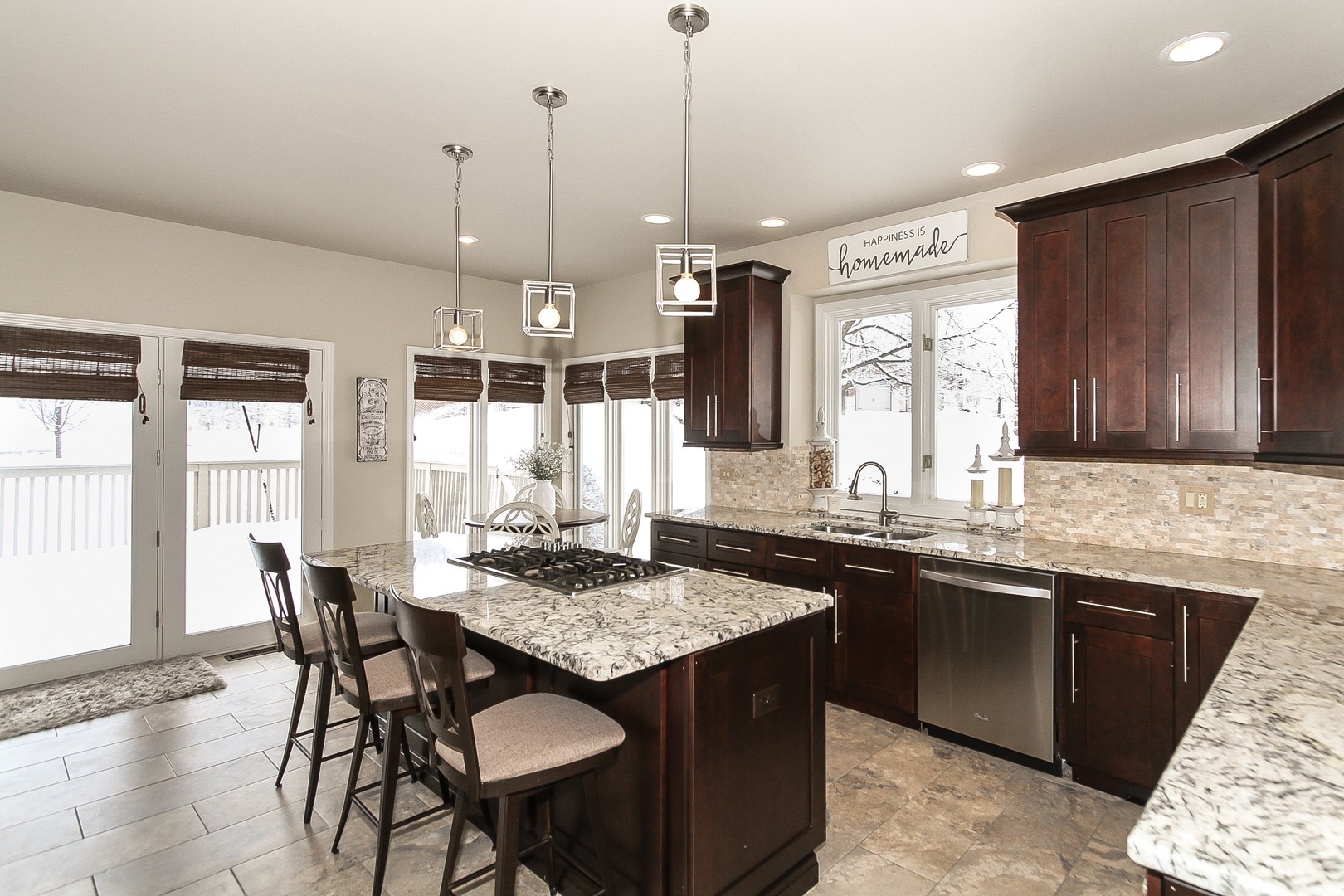 6N734 Henricksen Road St. Charles, IL 60175 - Photo 11 of 40 a kitchen with granite countertop sink stove dining table and chairs