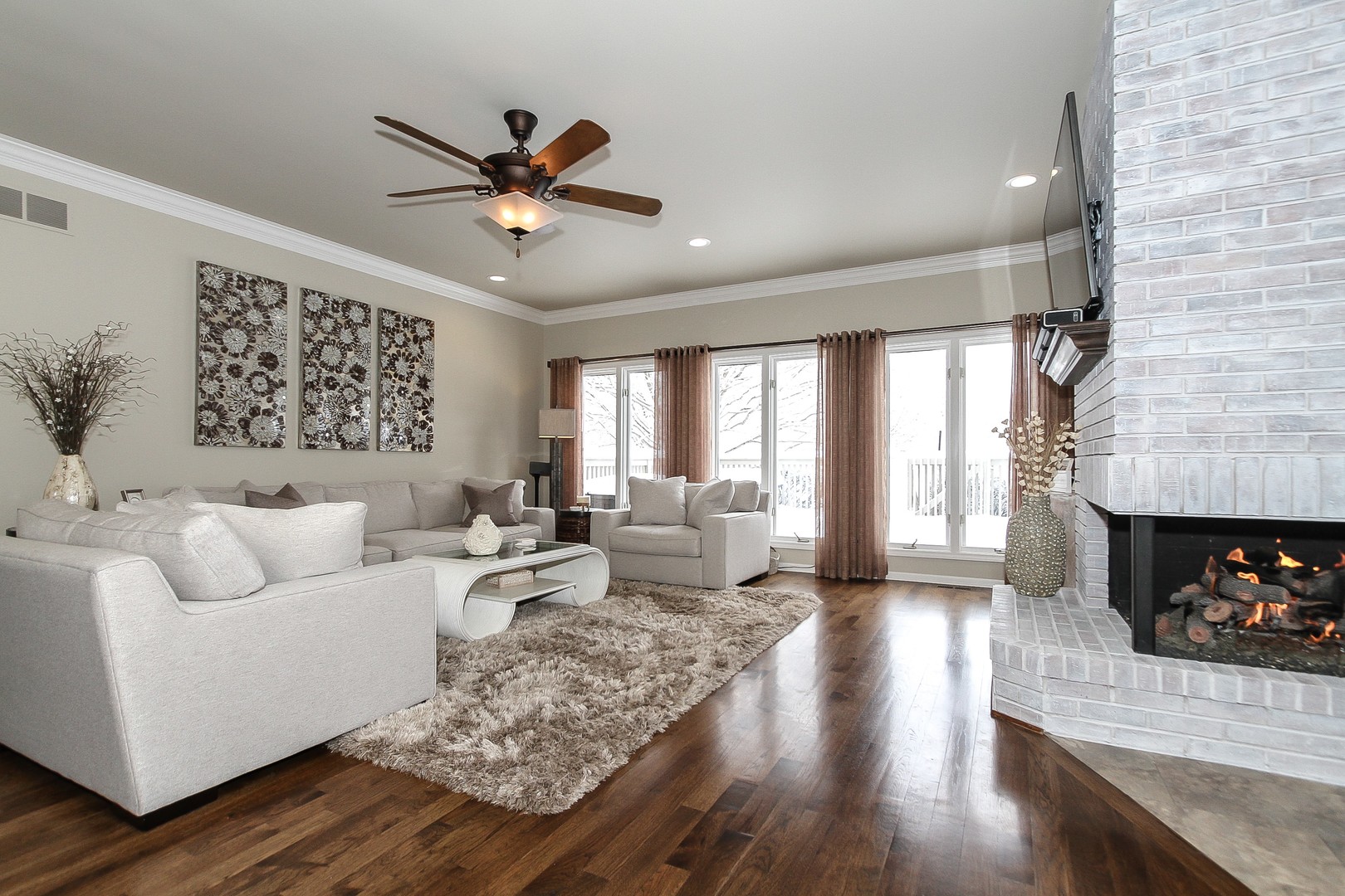 6N734 Henricksen Road St. Charles, IL 60175 - Photo 13 of 40 a living room with furniture a fireplace and wooden floor