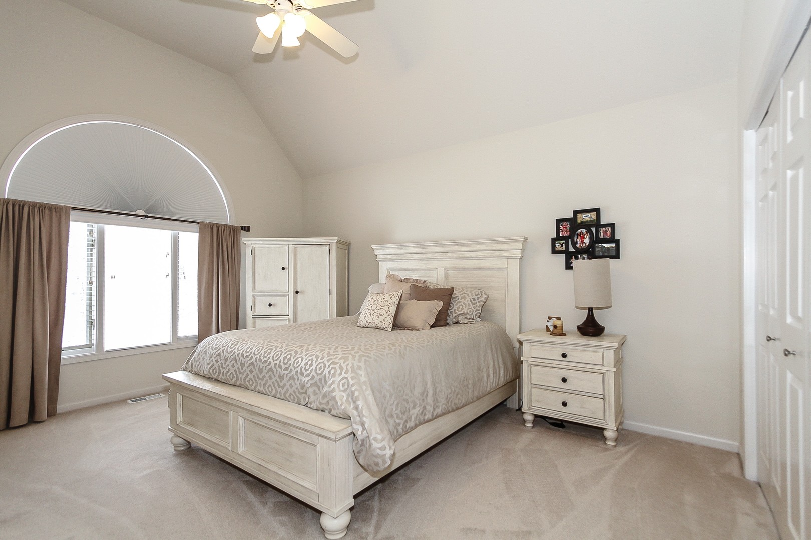 6N734 Henricksen Road St. Charles, IL 60175 - Photo 16 of 40 a bedroom with a bed and a chandelier