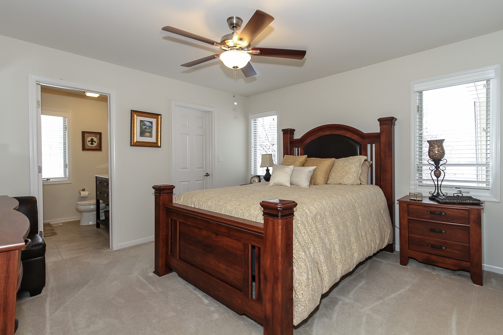 6N734 Henricksen Road St. Charles, IL 60175 - Photo 18 of 40 a bedroom with a bed and a chandelier