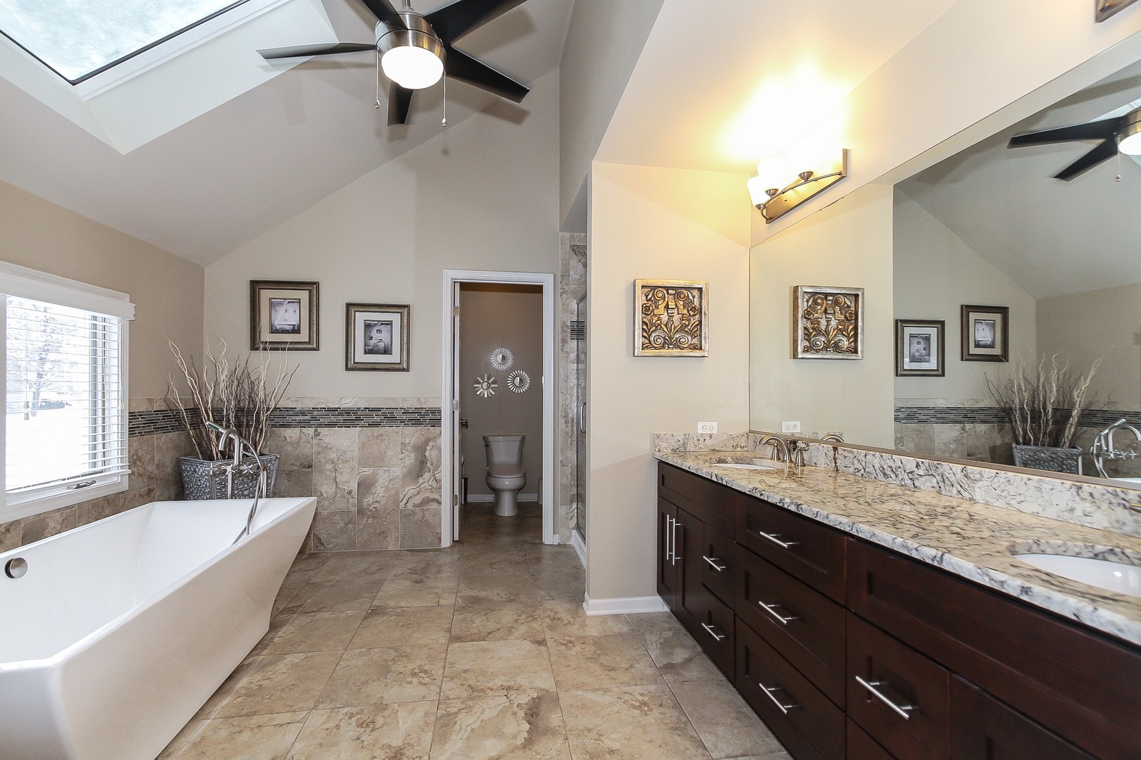 6N734 Henricksen Road St. Charles, IL 60175 - Photo 19 of 40 a spacious bathroom with a granite countertop tub double vanity sink and a mirror