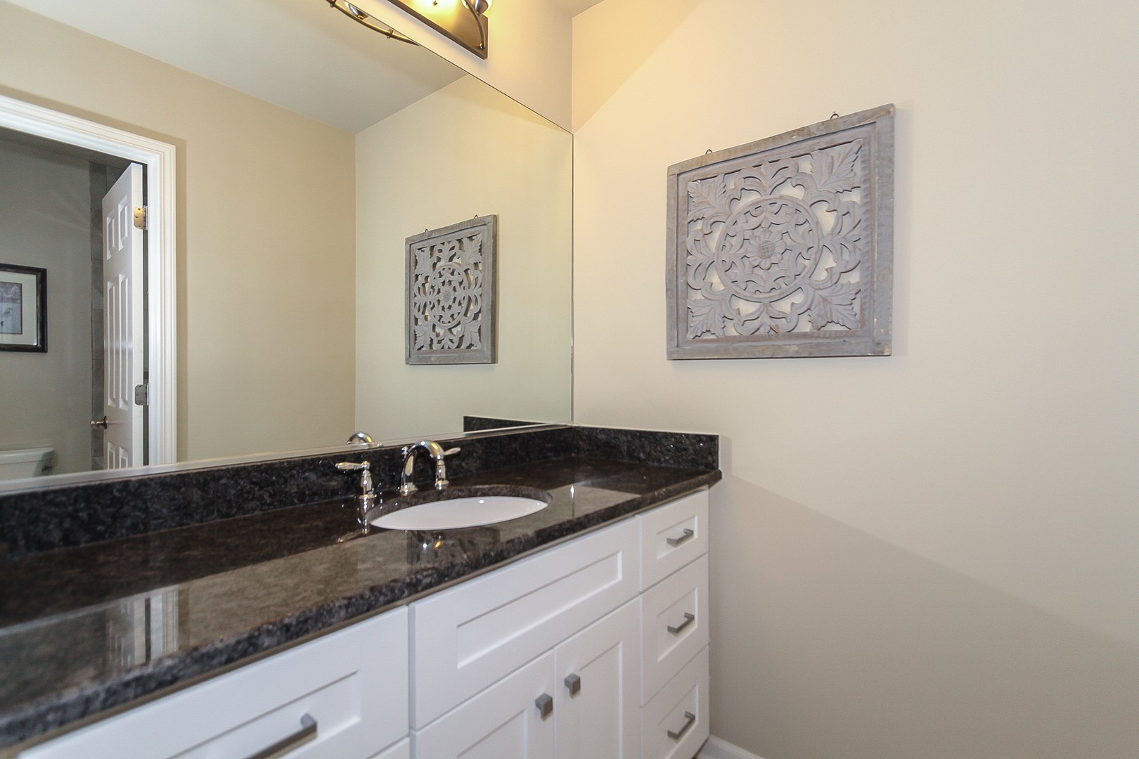 6N734 Henricksen Road St. Charles, IL 60175 - Photo 22 of 40 a sink and a mirror