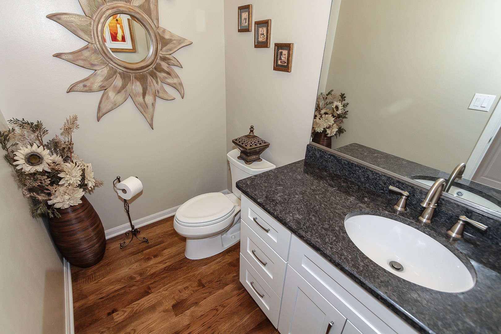 6N734 Henricksen Road St. Charles, IL 60175 - Photo 23 of 40 a bathroom with a granite countertop toilet sink and mirror
