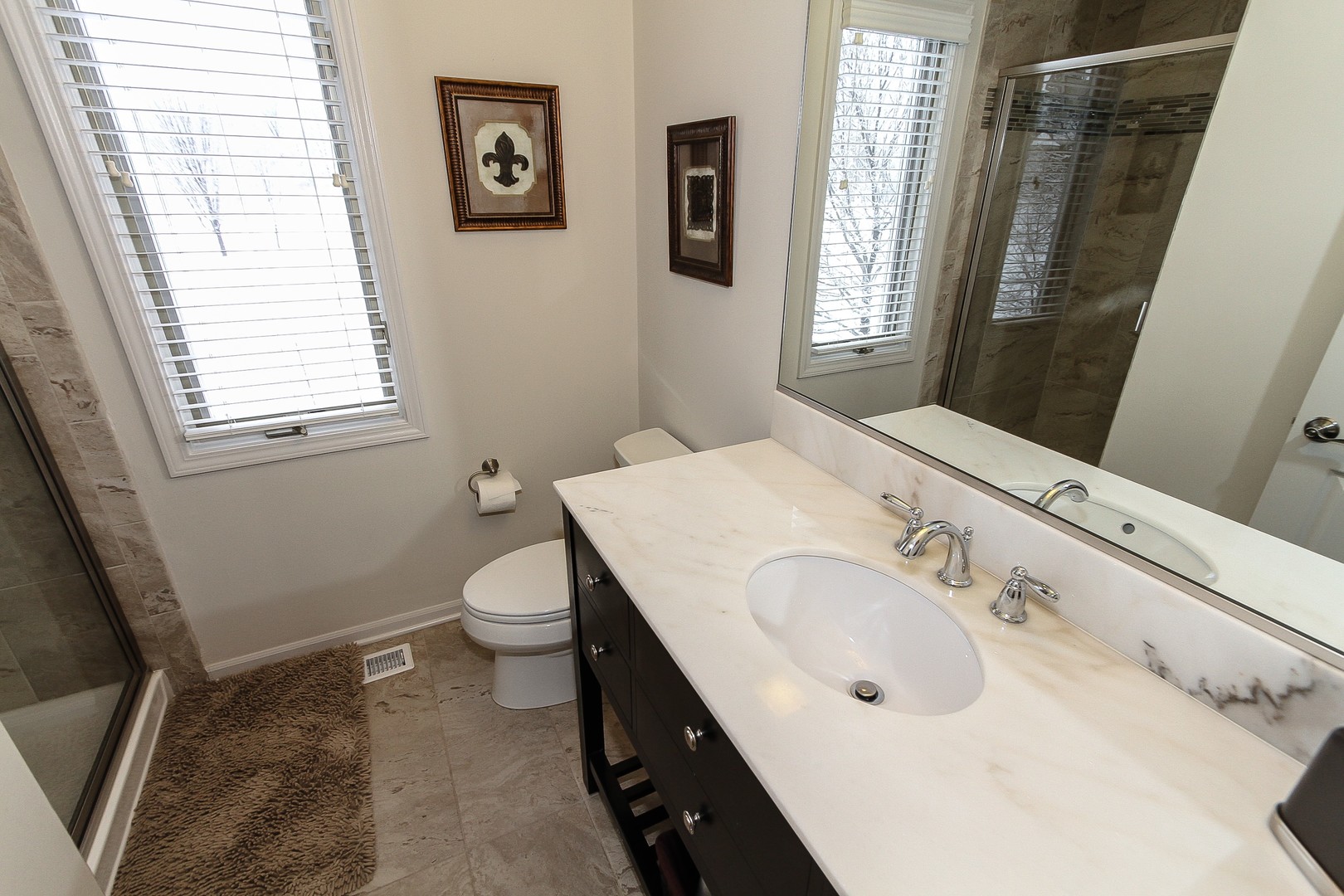6N734 Henricksen Road St. Charles, IL 60175 - Photo 24 of 40 a bathroom with a sink a toilet and window