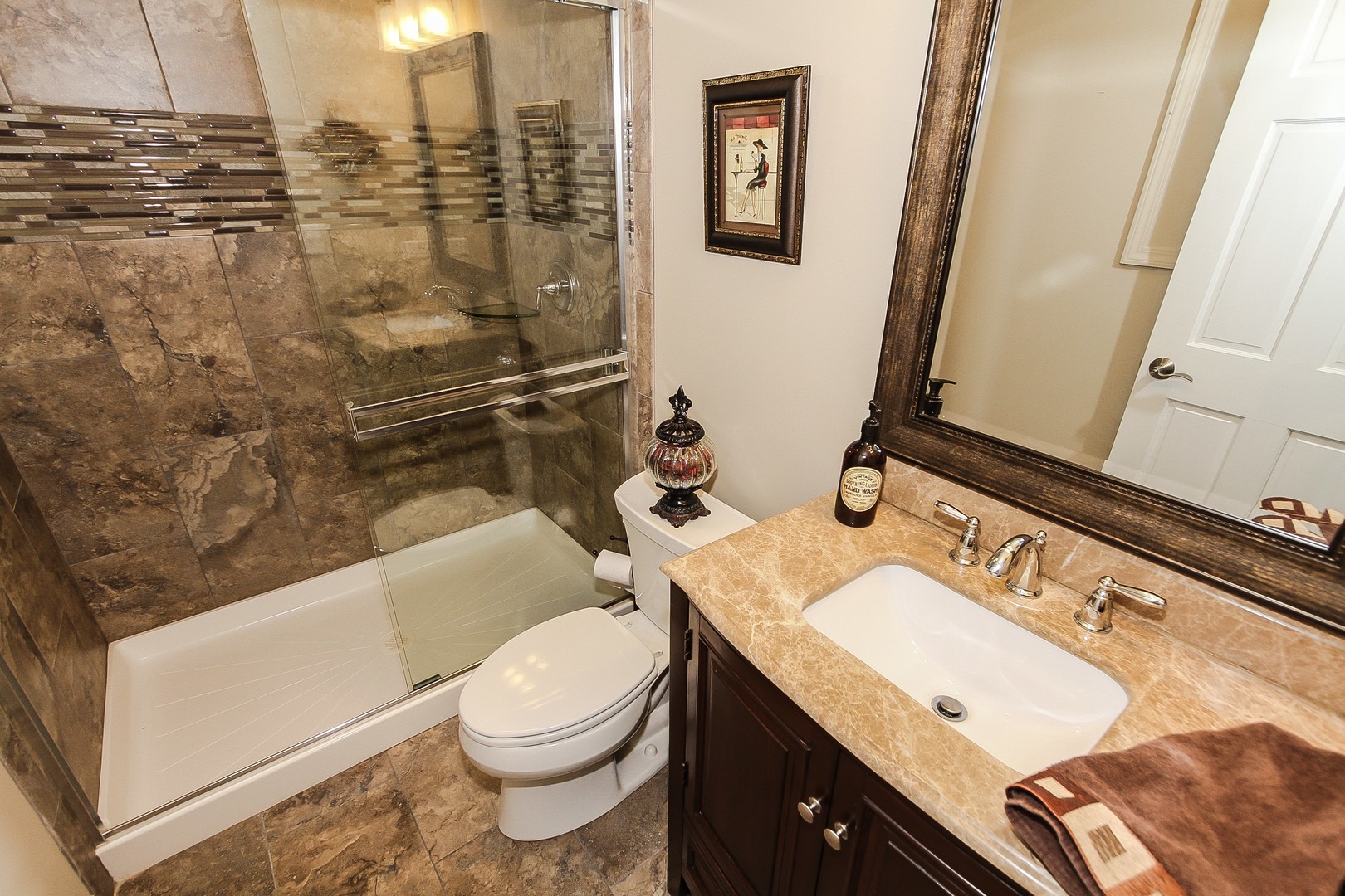 6N734 Henricksen Road St. Charles, IL 60175 - Photo 25 of 40 a bathroom with a granite countertop toilet sink and mirror